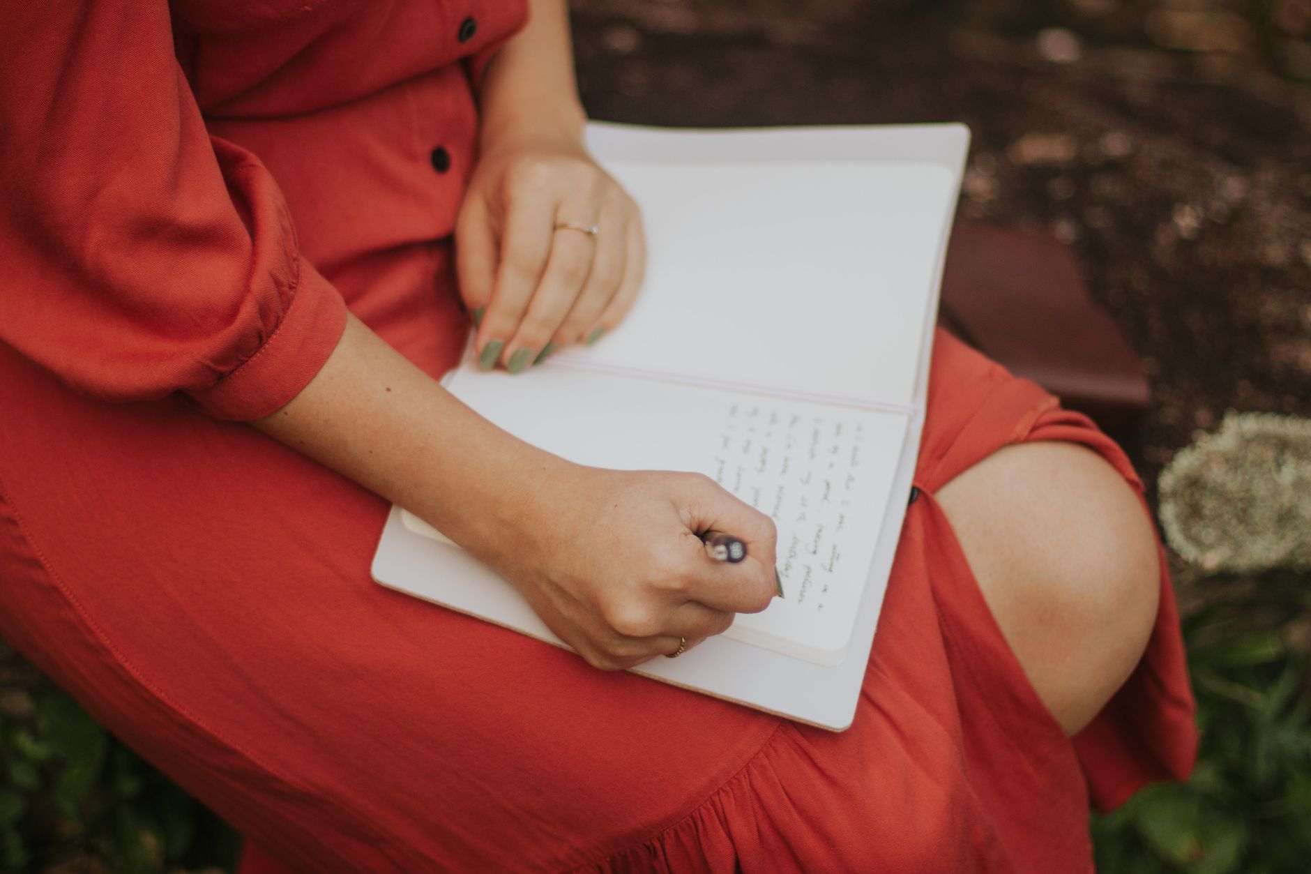 Solo traveler reading travel journal in alpine cabin